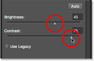 Manually adjusting the Brightness and Contrast sliders. Image © 2015 Steve Patterson, Photoshop Essentials.com