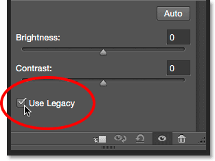 Selecting the Use Legacy option for the Brightness/Contrast adjustment. Image © 2015 Steve Patterson, Photoshop Essentials.com