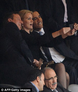 World leaders Cameron and Obama even took a moment to snap a photo of themselves at Nelson Mandela