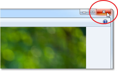 Clicking the Close icon in the top right of Windows Photo Viewer. Image © 2013 Photoshop Essentials.com