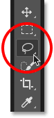 Selecting the Lasso Tool from the Toolbar in Photoshop.