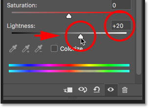 Increasing the Lightness value in Hue/Saturation to brighten the teeth.