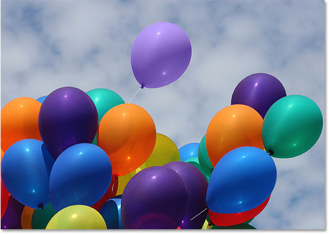 The orange balloon is now a light purple balloon. Image © 2016 Photoshop Essentials.com