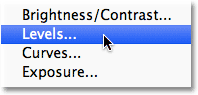 Choosing a Levels adjustment layer in Photoshop. Image © 2012 Photoshop Essentials.com