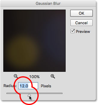 Dragging the Radius slider in the Gaussian Blur dialog box. 