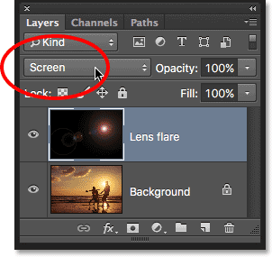 Changing the blend mode of the Lens Flare layer to Screen in Photoshop. 