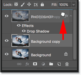 Dragging the Background copy layer above the Type layer in the Layers panel