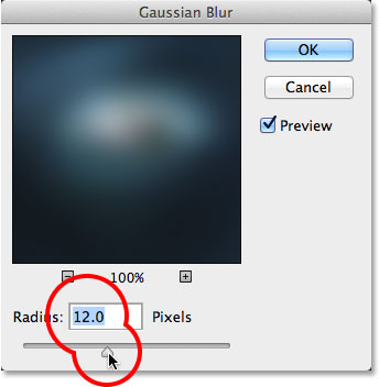 Dragging the Radius slider in the Gaussian Blur dialog box.