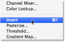 Selecting the Invert command from under the Image menu in Photoshop.