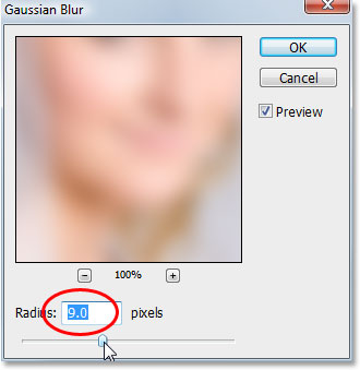 Applying the Gaussian Blur filter to the bottom layer in Photoshop.