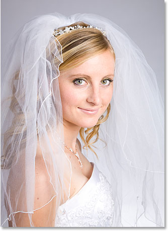 A photo of a young bride smiling.